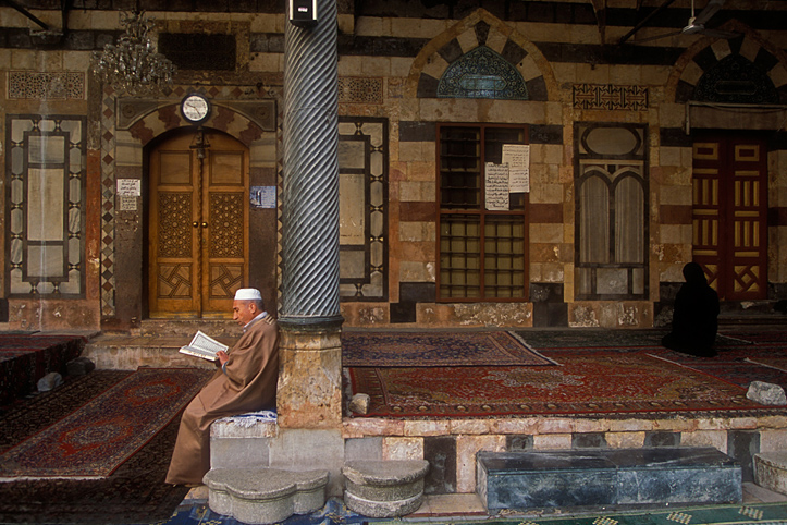 Syria. Damascus. Mosque. Praying and reading Koran